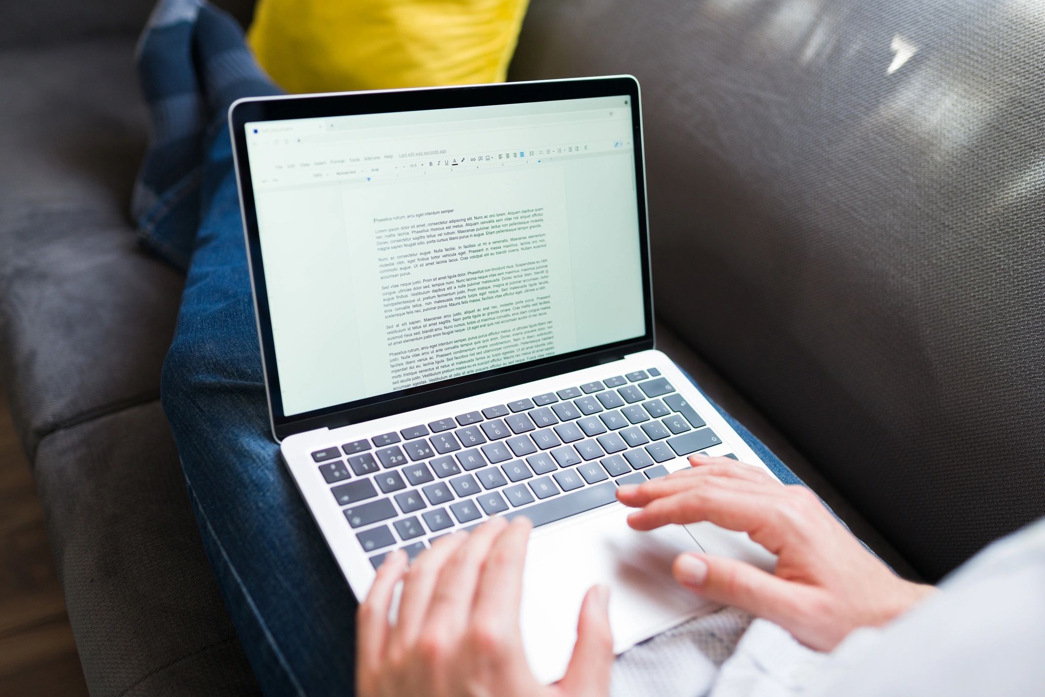 Portrait of a person working on a laptop