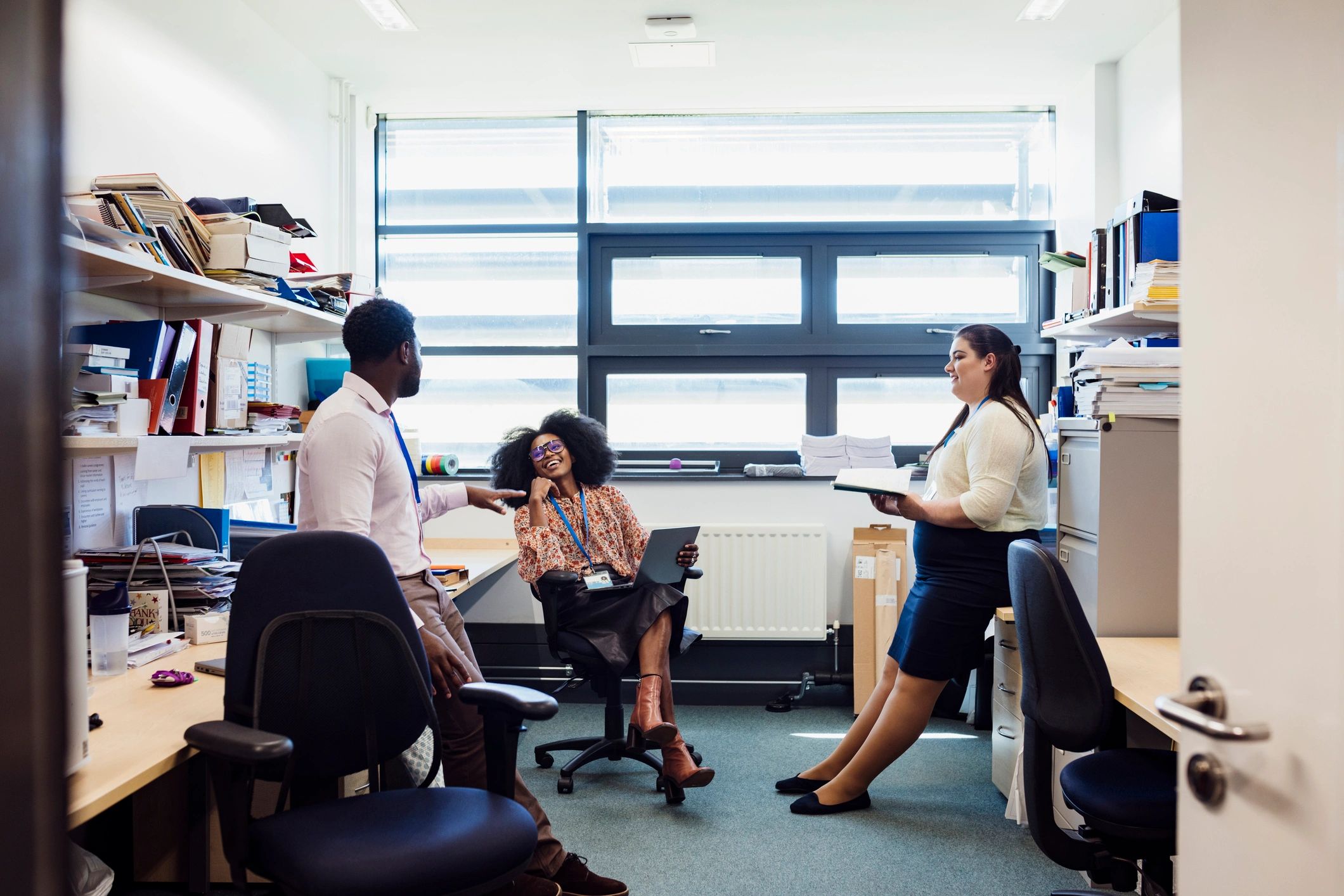 Two colleagues talking in an office